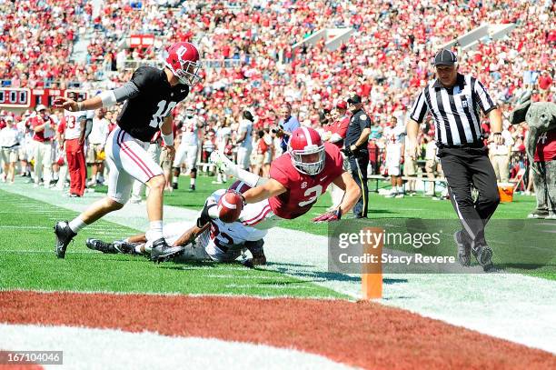 Vinnie Sunseri of the Crimson Team dives for the endzone following an interception during the Alabama A-Day spring game at Bryant-Denny Stadium on...