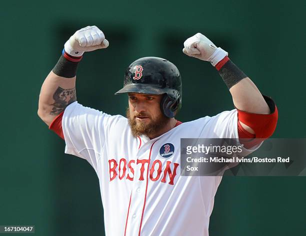 Jonny Gomes of the Boston Red Sox reacts after hitting a double against the Kansas City Royals in the eighth inning on April 20, 2013 at Fenway Park...