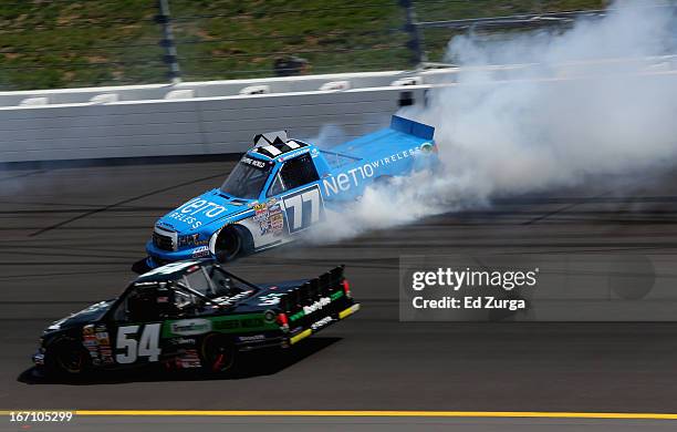 German Quiroga, driver of the Net 10 Toyota, spins as Darrell Wallace Jr., driver of the LibertyTireRecycling/Ground SmartRubber Toyota, drives by...