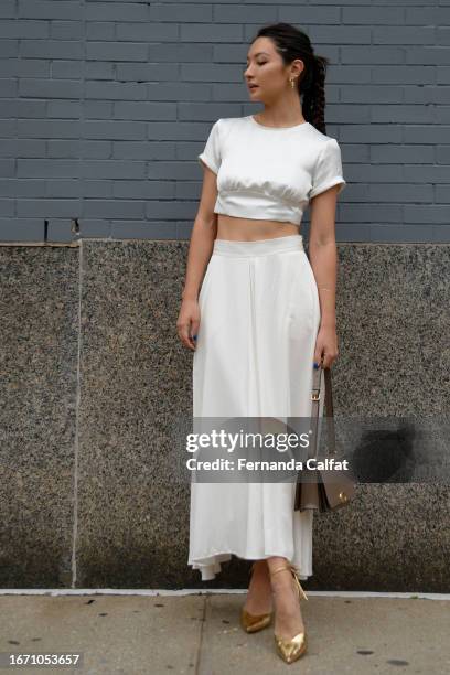 Bianca Kratky wears Reiss, Coach bag and Antropologie shoes outside Spring Studios during New York Fashion Week: The Shows on September 09, 2023 in...