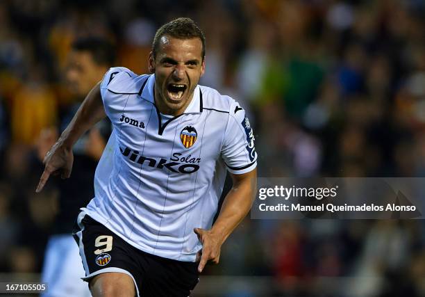 Roberto Soldado of Valencia celebrates after scoring the third goal during the La Liga match between Valencia CF and Malaga CF at Estadio Mestalla on...