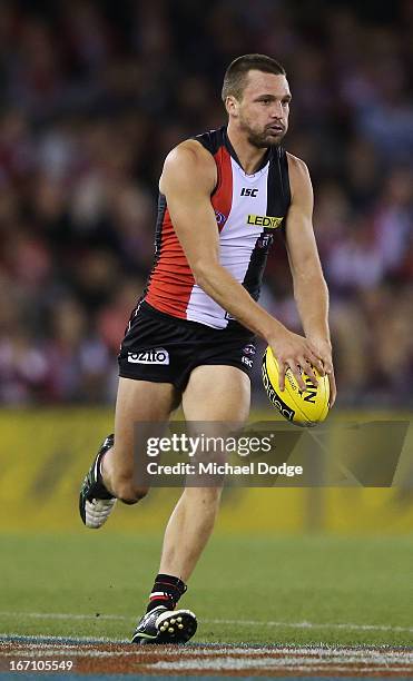 Jarryn Geary of the Saints looks ahead with the ball during the round four AFL match between the St Kilda Saints and the Essendon Bombers at Etihad...