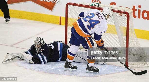 Brad Boyes of the New York Islanders scores against Ondrej Pavelec of the Winnipeg Jets during shoot-out action on April 20, 2013 at the MTS Centre...