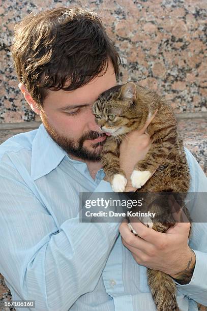Cat owner Mike Bridavsky and celebrity internet cat Lil Bub attends the "Lil Bub And Friendz" Tribeca Drive-In Screening during the 2013 Tribeca Film...