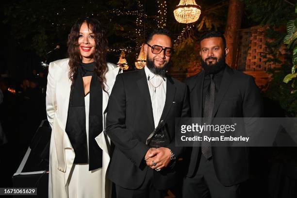 Co-chair Suzanne Boyd, Director X and Dax Dasilva pose at the 15th Annual Artists For Peace And Justice Fundraiser During Toronto International Film...