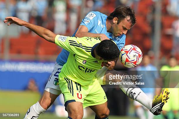 Isaac Diaz of Universidad de Chile, struggles for the ball with Mariano Uglessich of O'Higgins during a match between Universidad de Chile and...