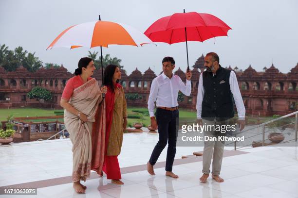 British Prime Minister Rishi Sunak and his wife Akshata Murty are shown around the Akshardham Hindu Temple by Sanjay Kara, a trustee for BAPS...