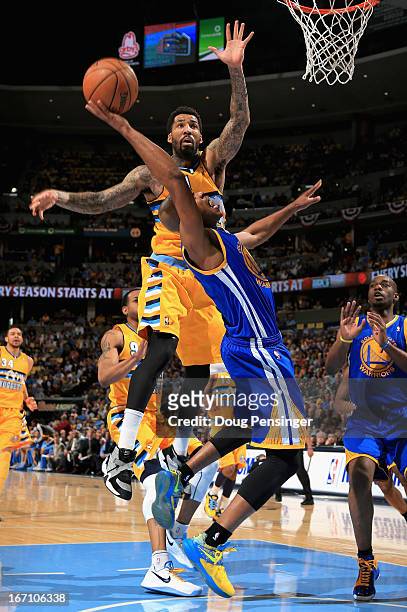 Jarrett Jack of the Golden State Warriors is fouled by Wilson Chandler of the Denver Nuggets during Game One of the Western Conference Quarterfinals...