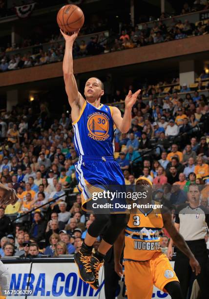 Stephen Curry of the Golden State Warriors puts up a shot against Ty Lawson of the Denver Nuggets during Game One of the Western Conference...