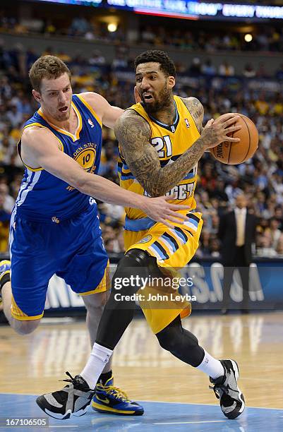 Denver Nuggets shooting guard Wilson Chandler drives to the basket against Golden State Warriors power forward David Lee in the second quarter. The...