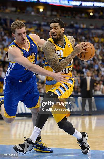 Denver Nuggets shooting guard Wilson Chandler drives to the basket against Golden State Warriors power forward David Lee in the second quarter. The...