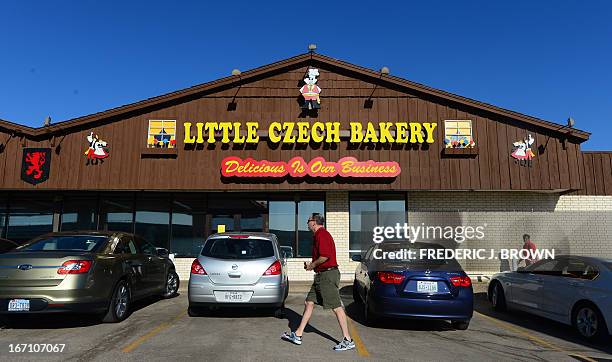 Man walks past the Little Czech Bakery in West, Texas, on April 20 three days after the April 17 fertilizer plant blast which killed and injured...