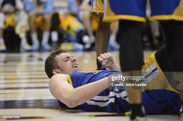 Golden State Warriors power forward David Lee on the floor after getting hurt in the fourth quarter. The Denver Nuggets took on the Golden State...