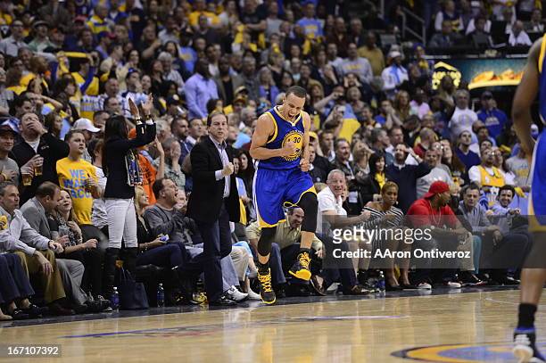 Golden State Warriors point guard Stephen Curry celebrates after hitting a three point shot in the final minute to tie the game in the fourth...