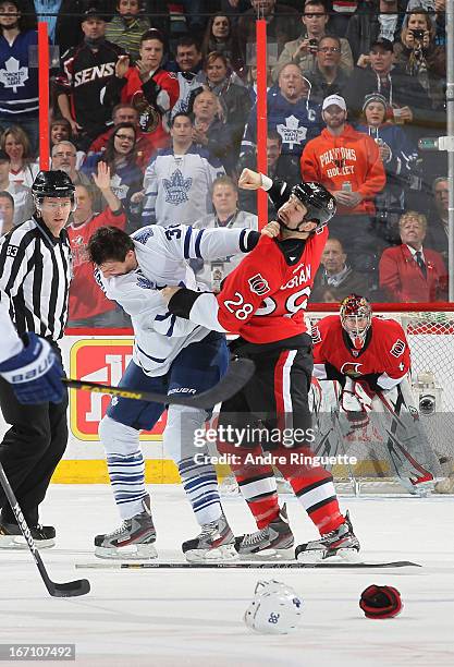 Matt Kassian of the Ottawa Senators throws a punch in a first period fight with Frazer McLaren of the Toronto Maple Leafs on April 20, 2013 at...