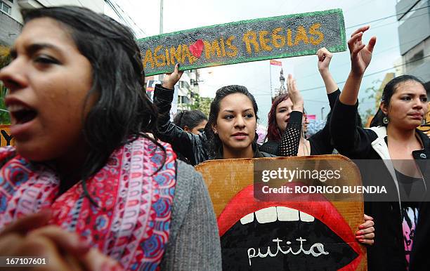 Women take part in the "March of the Whores" along a street in northern Quito on April 20, 2013. Some 500 people took to the streets to protest...