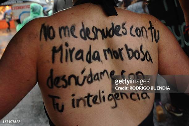 Woman takes part in the "March of the Whores" along a street in northern Quito on April 20, 2013. Some 500 people took to the streets to protest...