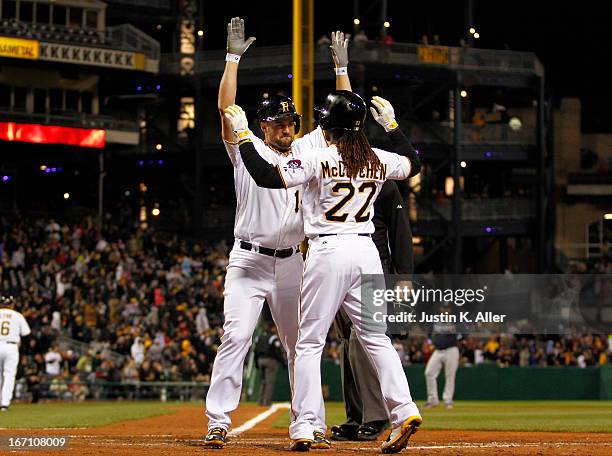 Gaby Sanchez of the Pittsburgh Pirates celebrates with Andrew McCutchen after hitting a two-run home run in the sixth inning against the Atlanta...