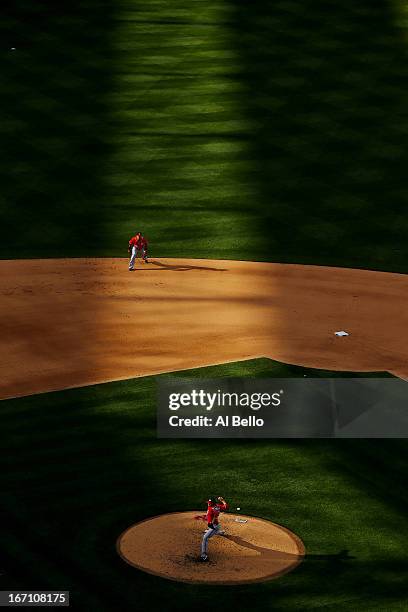 Ryan Mattheus of the Washington Nationals pitches as Ian Desmond of the Washington Nationals is ready against the New York Mets during their game on...