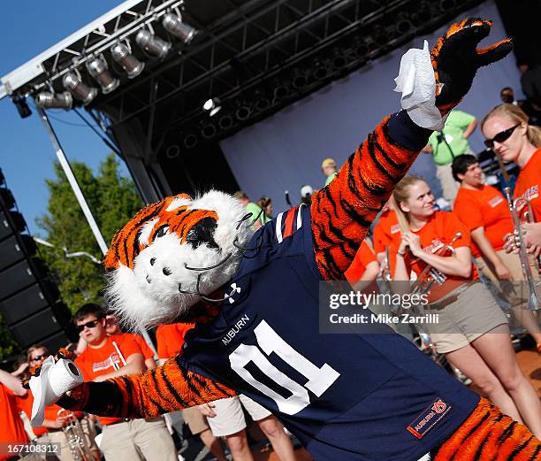 Auburn mascot Aubie throws a roll of toilet paper at the Auburn Oaks during the Toomer's Corner Celebration on April 20, 2013 in Auburn, Alabama.