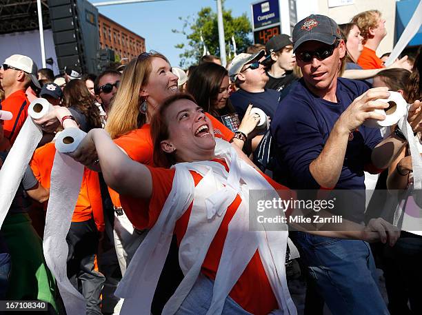 An Auburn fan throws a roll of toilet paper at the Auburn Oaks during the Toomer's Corner Celebration on April 20, 2013 in Auburn, Alabama.