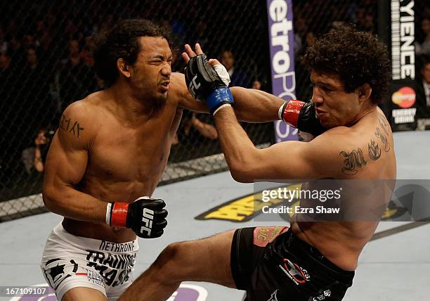 Benson Henderson punches Gilbert Melendez in their lightweight championship bout during the UFC on FOX event at the HP Pavilion on April 20, 2013 in...