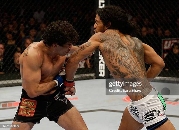 Benson Henderson punches Gilbert Melendez in their lightweight championship bout during the UFC on FOX event at the HP Pavilion on April 20, 2013 in...