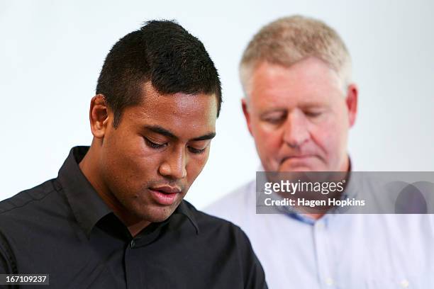 Julian Savea reads a statement to media about his assault charge while NZRU CEO Steve Tew looks on during a press conference at Rugby League Park on...