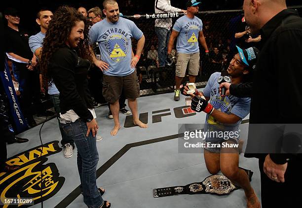 Benson Henderson proposes to his girlfirend Maria Magana during the UFC on FOX event at the HP Pavilion on April 20, 2013 in San Jose, California.