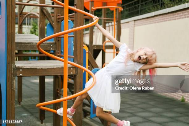 shouting girl playing on the playground. - blonde wood texture stockfoto's en -beelden