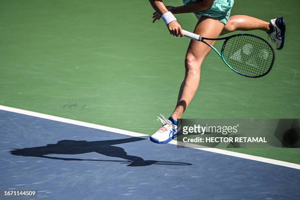 Ma Yexin of China serves against Despina Papamichail of Greece during their women's singles qualifying match prior to the start of the WTA Guangzhou...