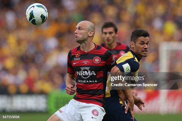 Pedj Bojic of the Mariners and Dino Kresinger of the Wanderers contest the ball during the A-League 2013 Grand Final match between the Western Sydney...