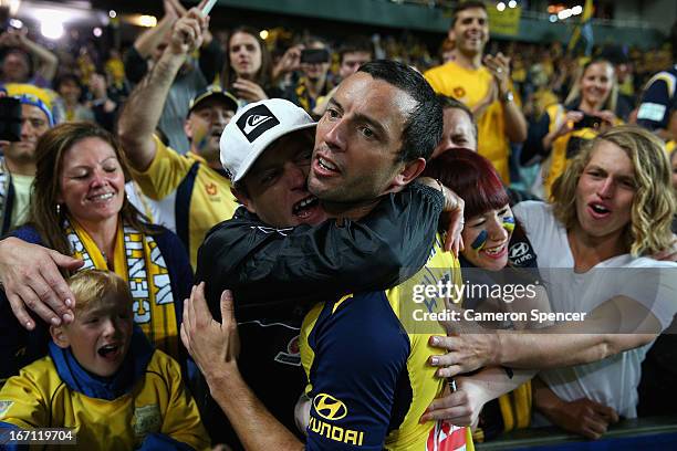 Mariners captain John Hutchinson celebrates with fans after winning the A-League 2013 Grand Final match between the Western Sydney Wanderers and the...