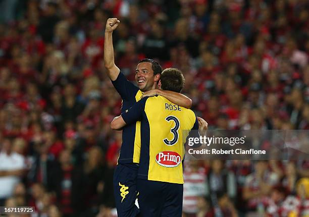 John Hutchinson and Joshua Rose of the Mariners celebrate after the Mariners defeated the Wanderers after the A-League 2013 Grand Final match between...