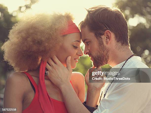 young mixed race couple genießen sie zusammen - black men kissing white women stock-fotos und bilder