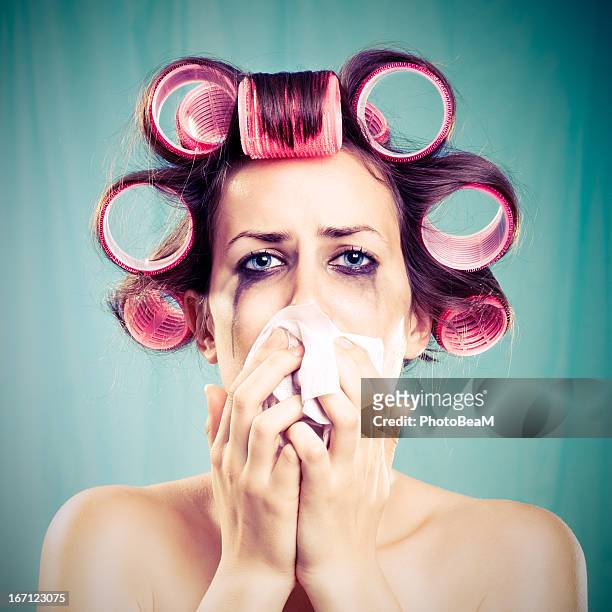 woman crying with pink hair curlers - hysteria stock pictures, royalty-free photos & images