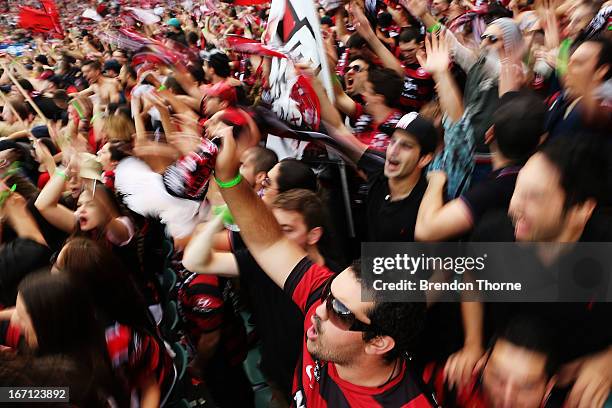 Western Sydney Wanderers fans cheer during the A-League 2013 Grand Final match between the Western Sydney Wanderers and the Central Coast Mariners at...