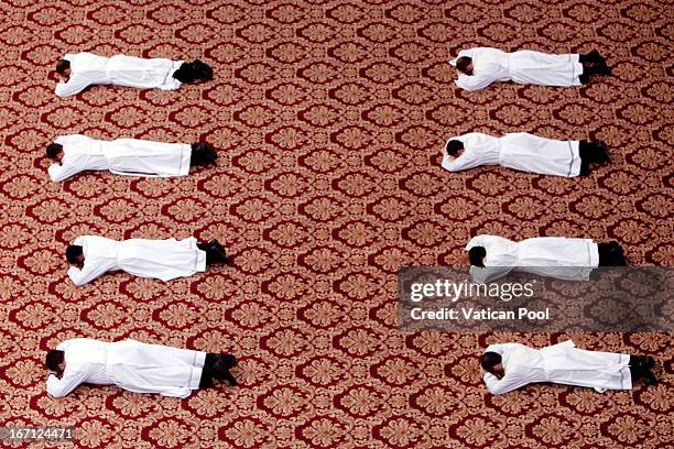 Newly appointed priests pray during a priestly ordinations held by Pope Francis at St. Peter's Basilica on April 21, 2013 in Vatican City, Vatican....