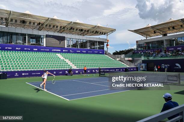 Greece's Despina Papamichail of Greece hits a return against China's Ma Yexin during their women's singles qualifying match prior to the start of the...