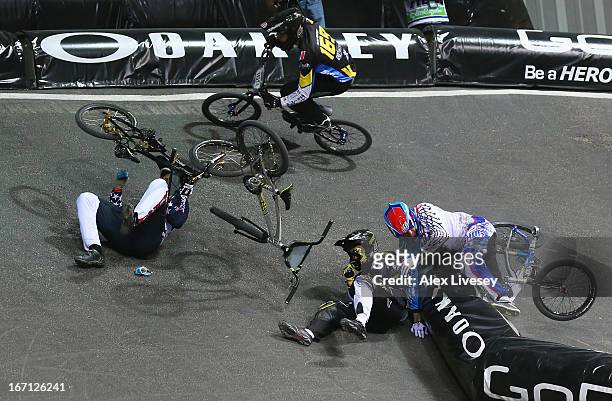 Lain van Ogle of USA crashes with Rihards Veide of Latvia during the Men's Elite 1/8 Finals 2nd round race in the UCI BMX Supercross World Cup at the...