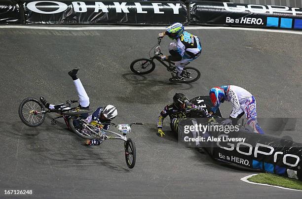 Lain van Ogle of USA crashes with Rihards Veide of Latvia during the Men's Elite 1/8 Finals 2nd round race in the UCI BMX Supercross World Cup at the...