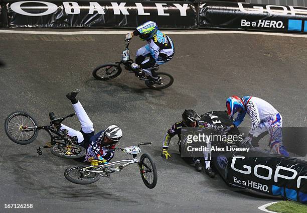 Lain van Ogle of USA crashes with Rihards Veide of Latvia during the Men's Elite 1/8 Finals 2nd round race in the UCI BMX Supercross World Cup at the...