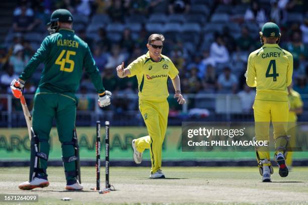 Australia's Adam Zampa celebrates with teammate Alex Carey after dismissing South Africa's Heinrich Klaasen during the fifth one-day international...