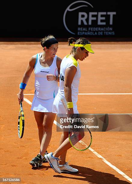 Lourdes Dominguez and Anabel Medina chat during their double match against Shuko Aoyama and Misaki Doi of Japan during the day two of the Fed Cup...