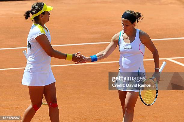 Lourdes Dominguez and Anabel Medina chat during their double match against Shuko Aoyama and Misaki Doi of Japan during the day two of the Fed Cup...