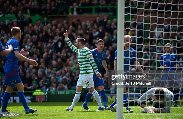 Gary Hooper of Celtic celebrates after scoring his second goal and his team's third goal past Antonio Reguero of Inverness Caledonian Thistle the...