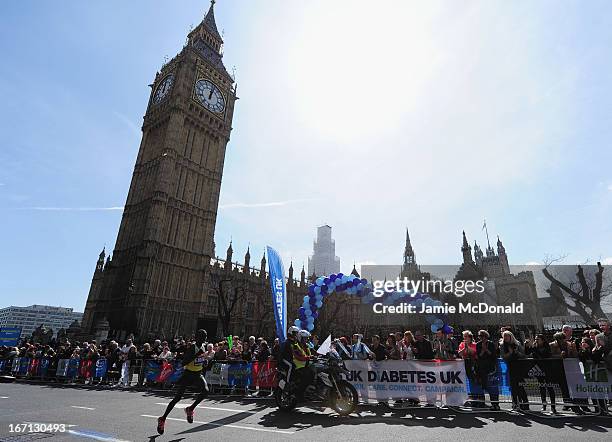 Emmanuel Mutai of Kenya passes Westminster during the Virgin London Marathon 2013 on April 21, 2013 in London, England