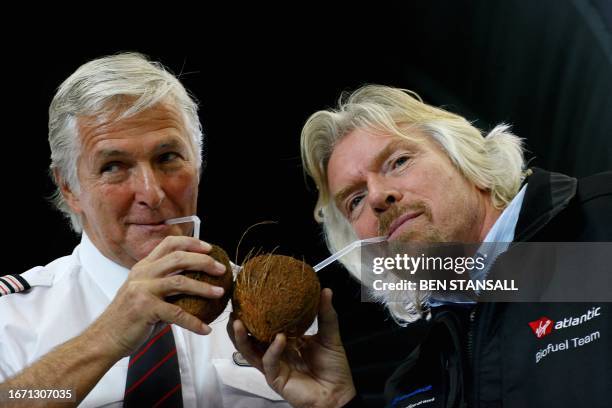 Virgin Atlantic chief Richard Branson poses with a coconut in front of a Virgin Atlantic Boeing 747 with pilot Captain Geoff Andreasen before the...