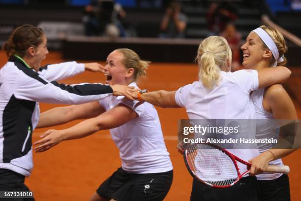 Anna-Lena Groenefeld of Germany celebrates victory with her team mates Andrea Petkovic , Sabine Lisicki and Germany`s team captain Barbara Rittner...