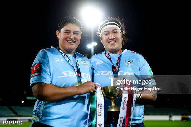 Co-captains Krystal Murray and Hikitia Wikaira of Northland pose with the Farah Palmer Cup Championship trophy after winning the Farah Palmer Cup...